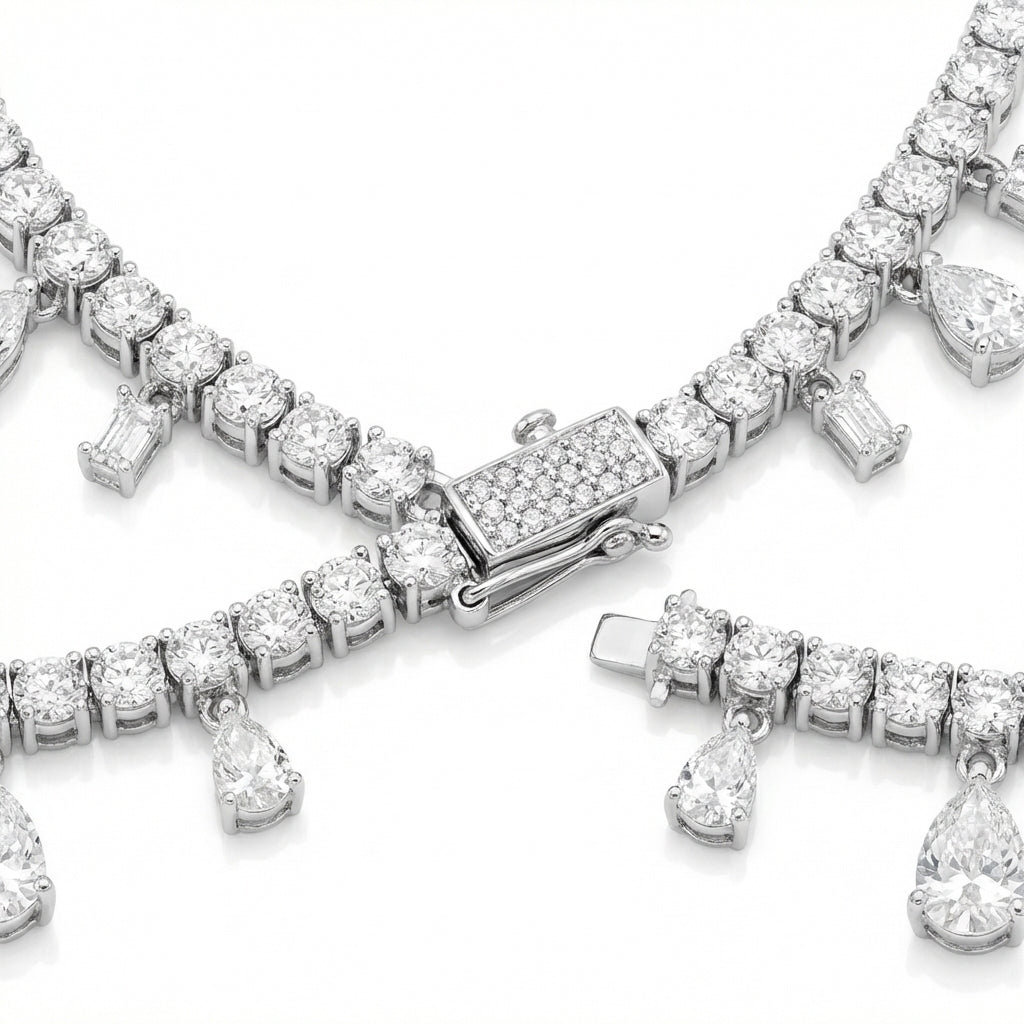 Diamond bracelet with teardrop pendants on a white background