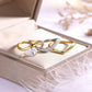 Yellow gold pear bridal set on neutral/romantic background. Alt: “Pear Moissanite Engagement Ring Set – 18K Yellow Gold.”