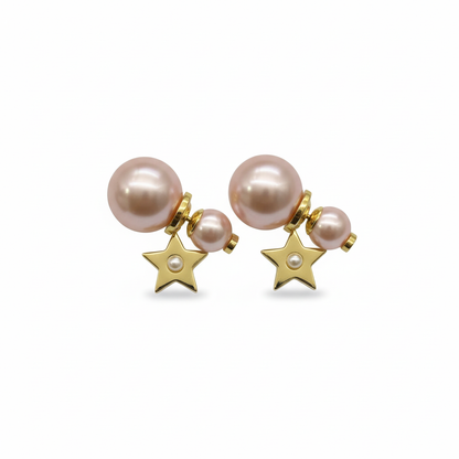 Pearl earrings Dior Gold in PearlPair of pearl earrings with gold star charms on a white background