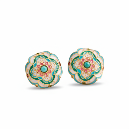 Pair of floral earrings with green and pink design on a white background