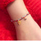 A festive yet refined piece that blends minimalist elegance with warm holiday tones. Handwoven red and green rope embraces a gold-plated 925 silver pinecone charm