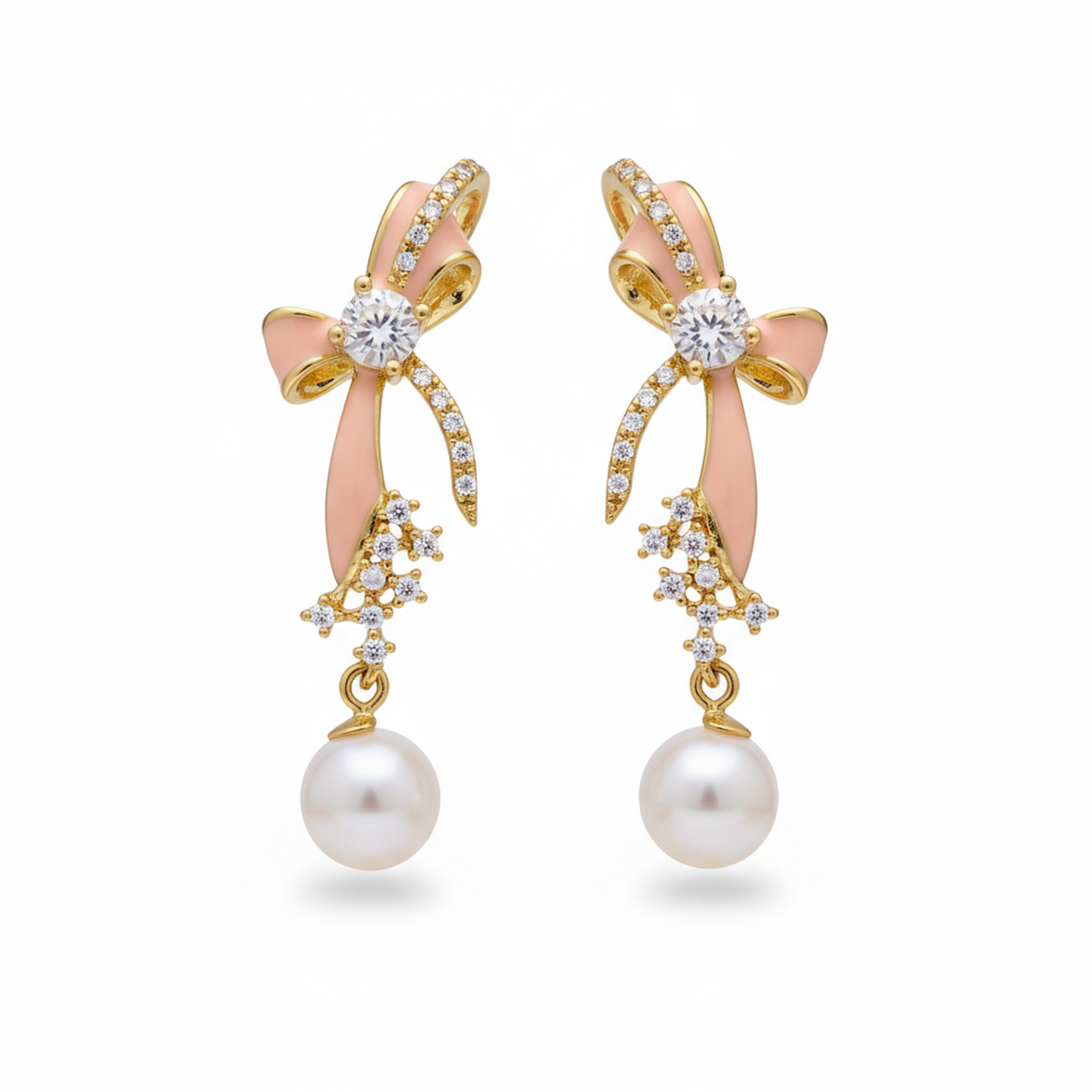 Pair of earrings with pink bows, gold accents, and pearl drops on a white background