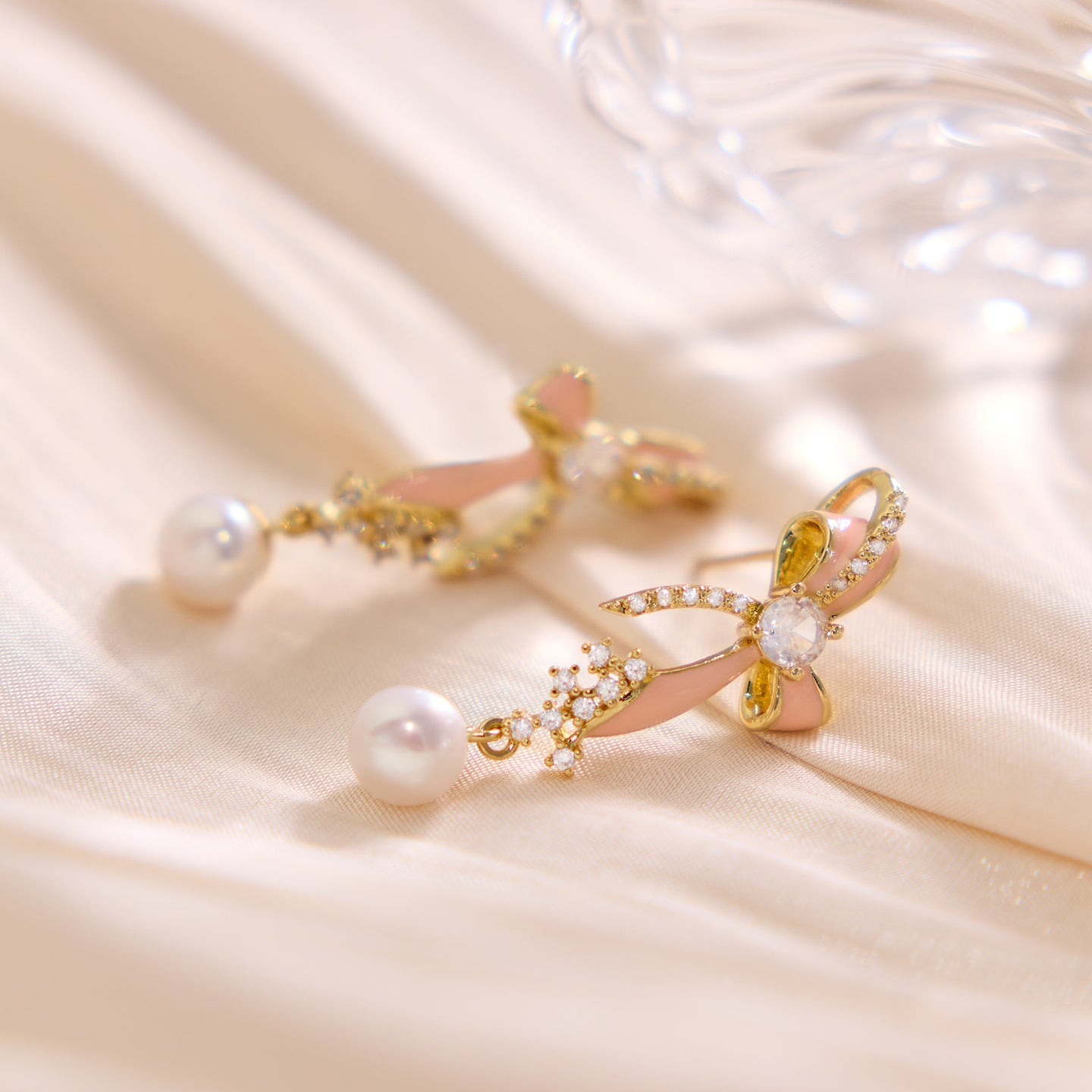 “Playful Charm Pearl Bow Earrings – minimalist sterling silver design for women”