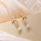 “Playful Charm Pearl Bow Earrings – minimalist sterling silver design for women”