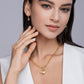 Model wearing the necklace in a soft, romantic setting (soft lighting, roses, sunset).