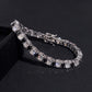 Straight-on to clearly showcase the alternating white and black round moissanite stones in continuous pave.