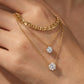 Macro, necklace draped across female hand, natural curve, warm soft light, mirror metal shine, sharp sparkle, blurred skin background, detailed texture, intimate luxury feel.