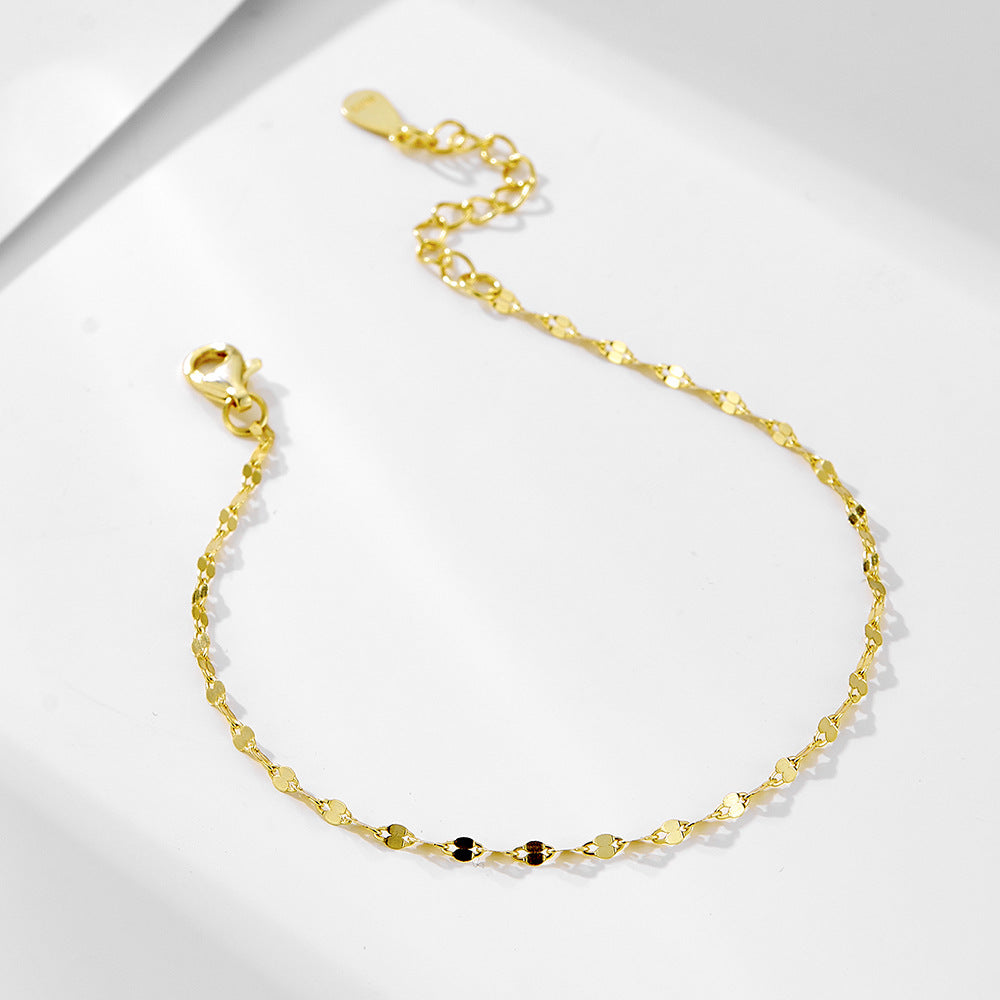 Close-up of Lips Charm and Gold Plated Chain Details