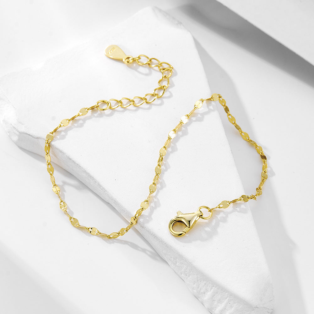 Close-up of Lips Charm and Gold Plated Chain Details