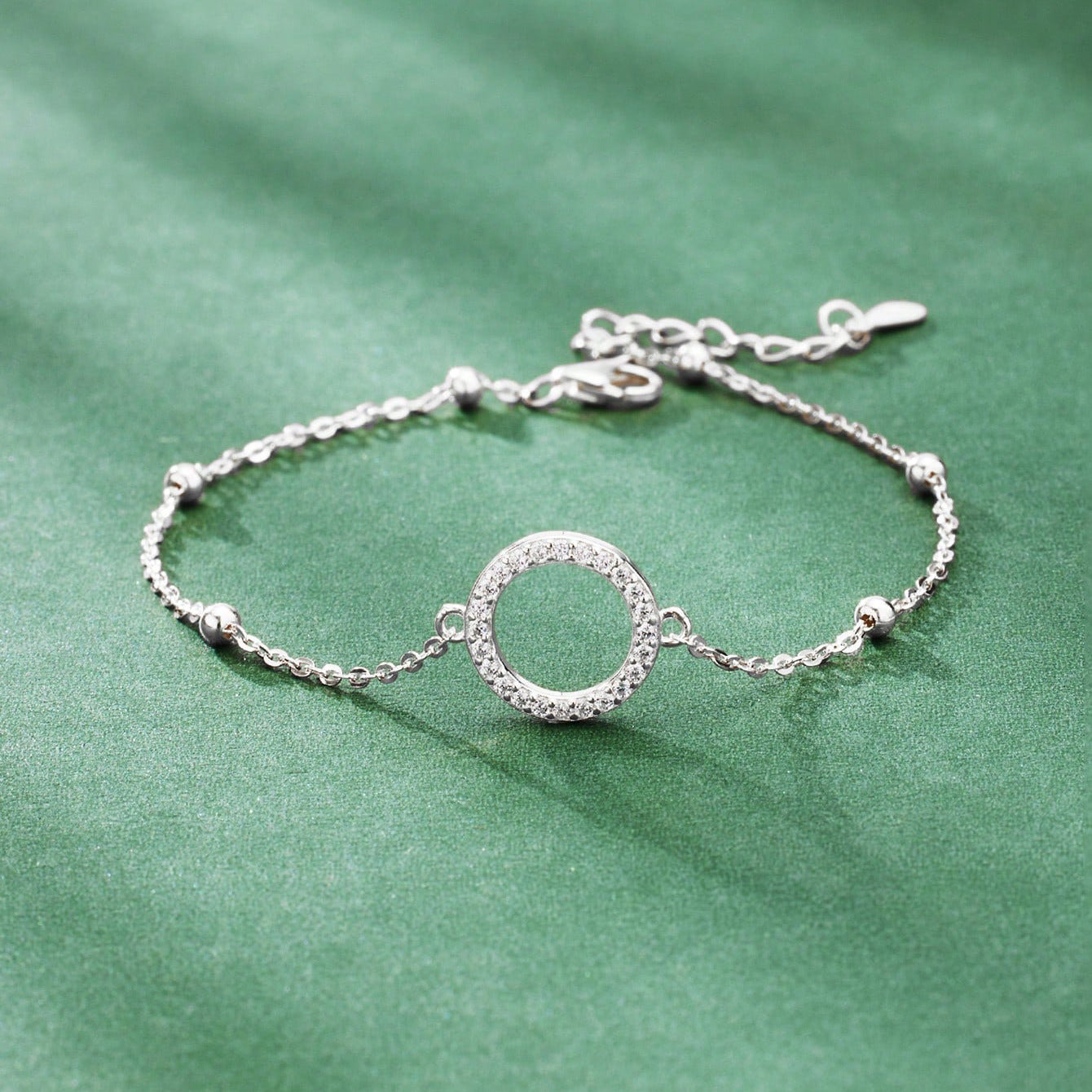 Close-up of Silver Beads and Zircon Charm Design