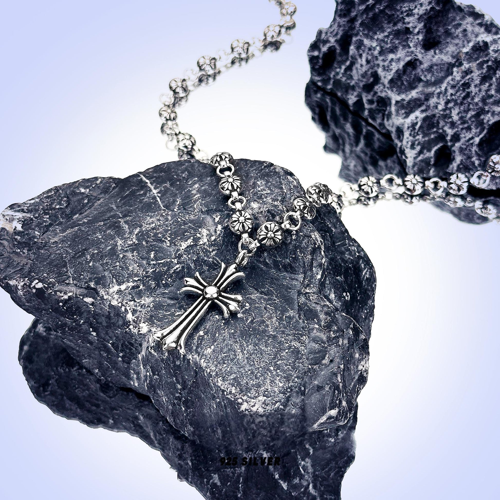 “Macro shot highlighting metallic bead structure of cross pendant”