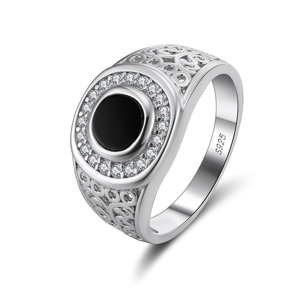 “Turkish black onyx men’s ring flat lay on textured surface”