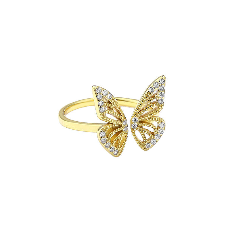 “Flat lay of S925 sterling silver butterfly ring with micro pave CZ stones”