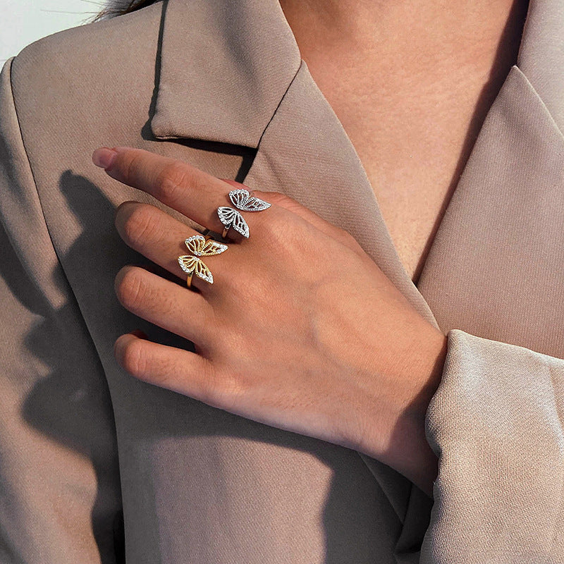 “Woman wearing elegant S925 silver butterfly open ring with dazzling stones”