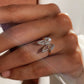 “Side view of adjustable sterling silver butterfly ring with light luxury design”