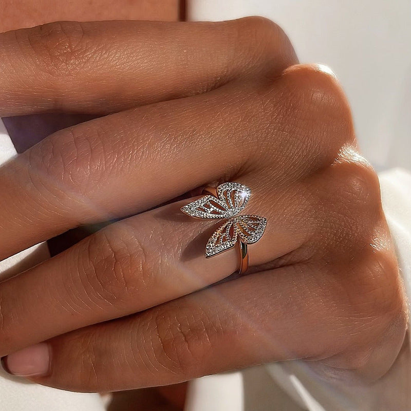 “Side view of adjustable sterling silver butterfly ring with light luxury design”