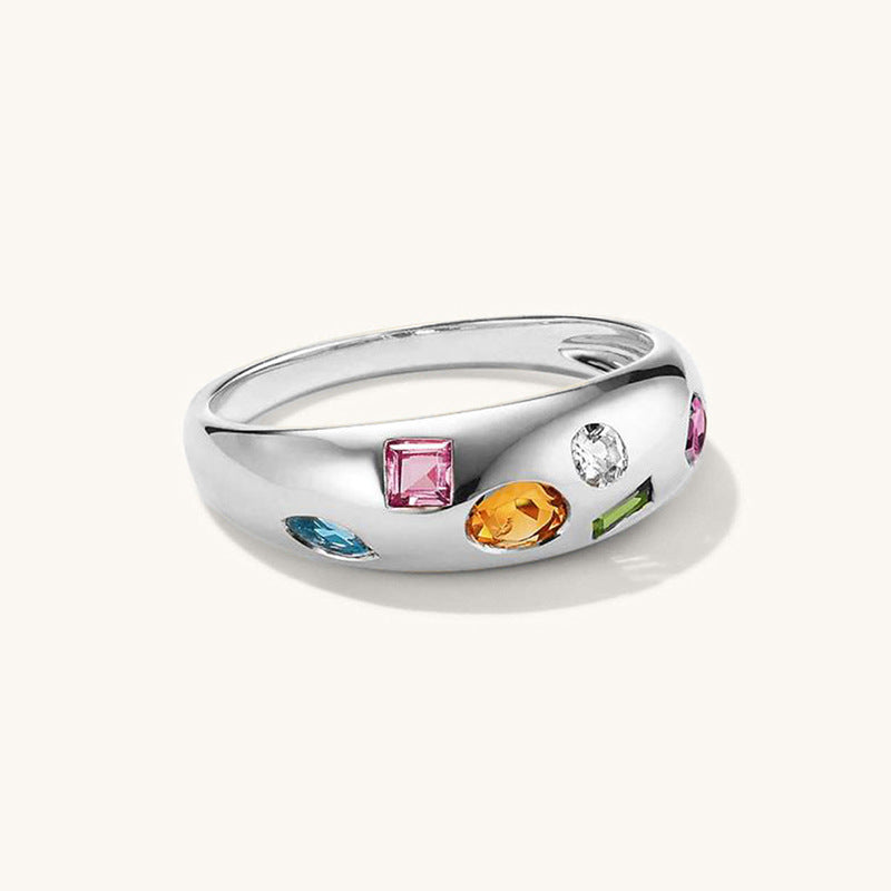 “Flat lay of S925 sterling silver colorful zircon ring with multicolor stones for women”