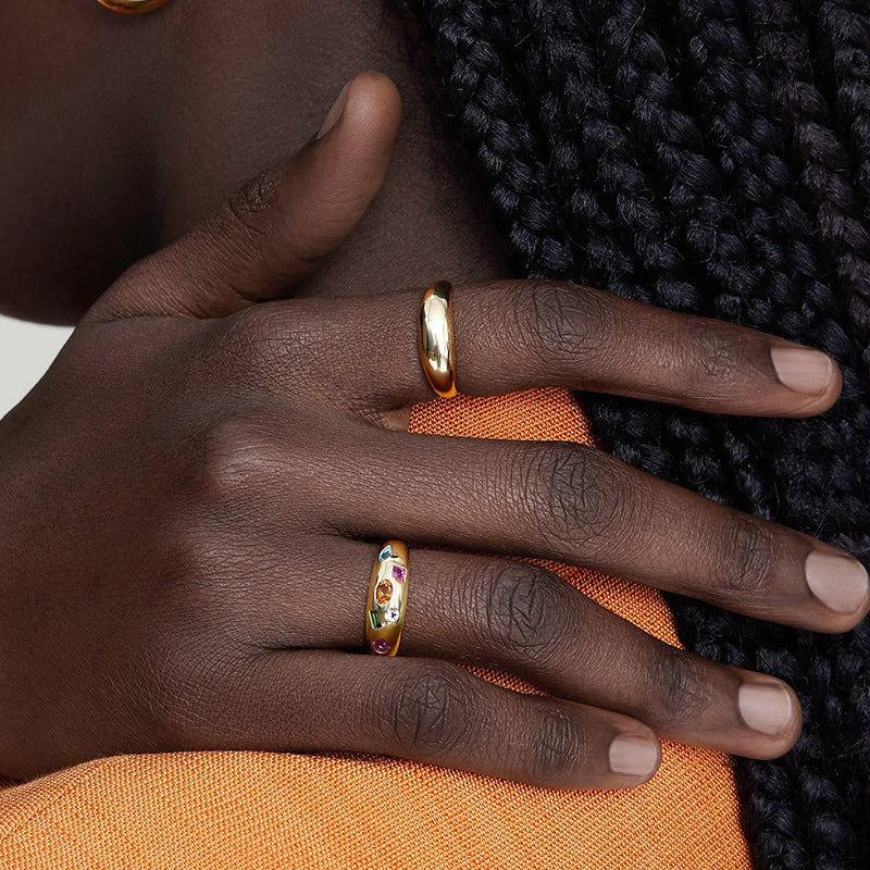 “Woman wearing elegant colorful zircon ring in sterling silver light luxury style”