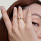 “Woman wearing elegant colorful zircon ring in sterling silver light luxury style”