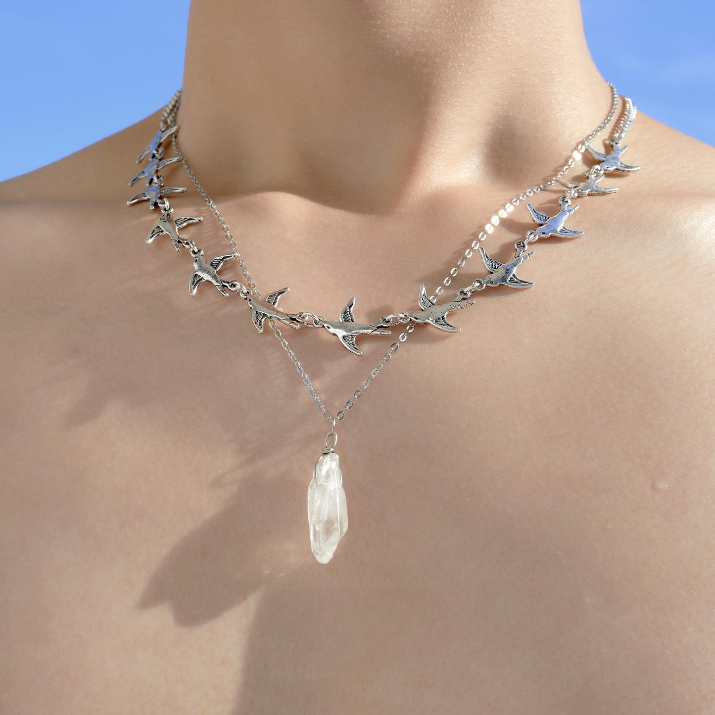 "Minimalist cold-tone silver bird necklace for men and women"