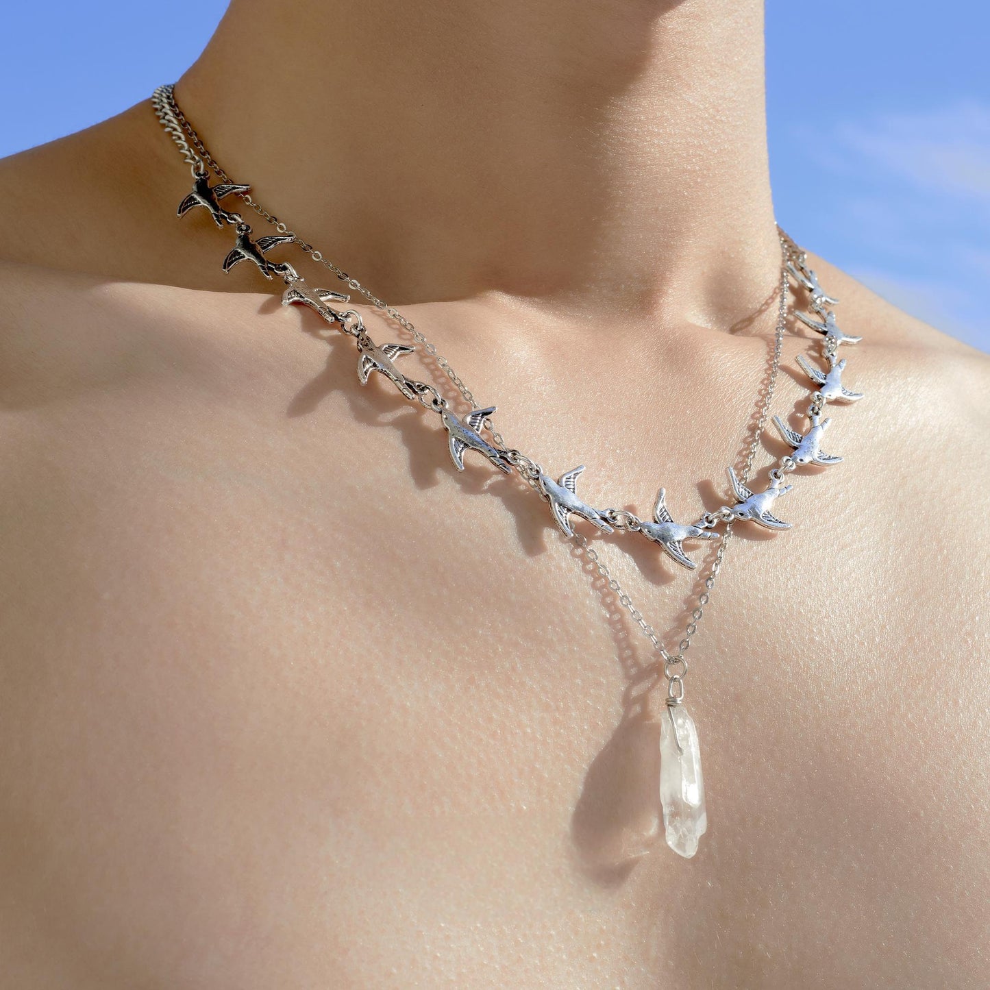 "Minimalist cold-tone silver bird necklace for men and women"