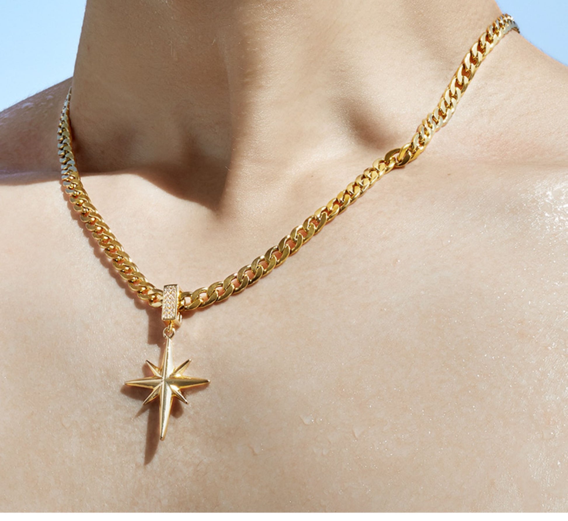 “Male model wearing sterling silver eight point star necklace streetwear style”