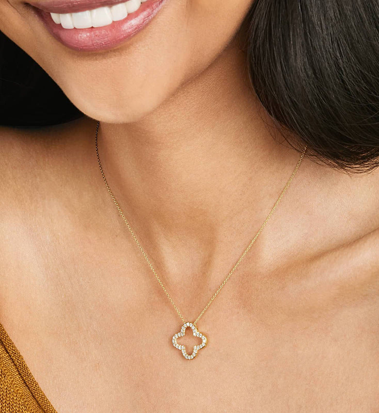 Woman Wearing Minimalist Silver Four Leaf Clover Necklace