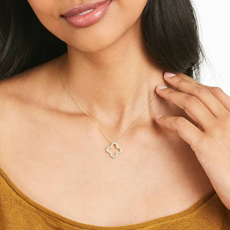 Woman Wearing Minimalist Silver Four Leaf Clover Necklace