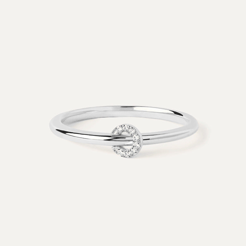 “Flat lay of S925 sterling silver pavé circle ring with dainty lock design”
