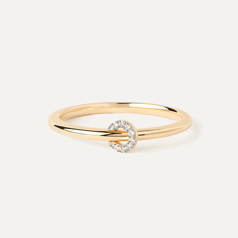 “Flat lay of S925 sterling silver pavé circle ring with dainty lock design”