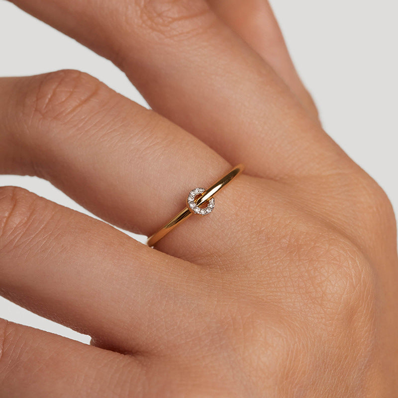 “Woman wearing minimalist S925 silver circle ring with full pavé stones”