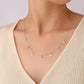 “Model wearing geometric teardrop silver zircon necklace”