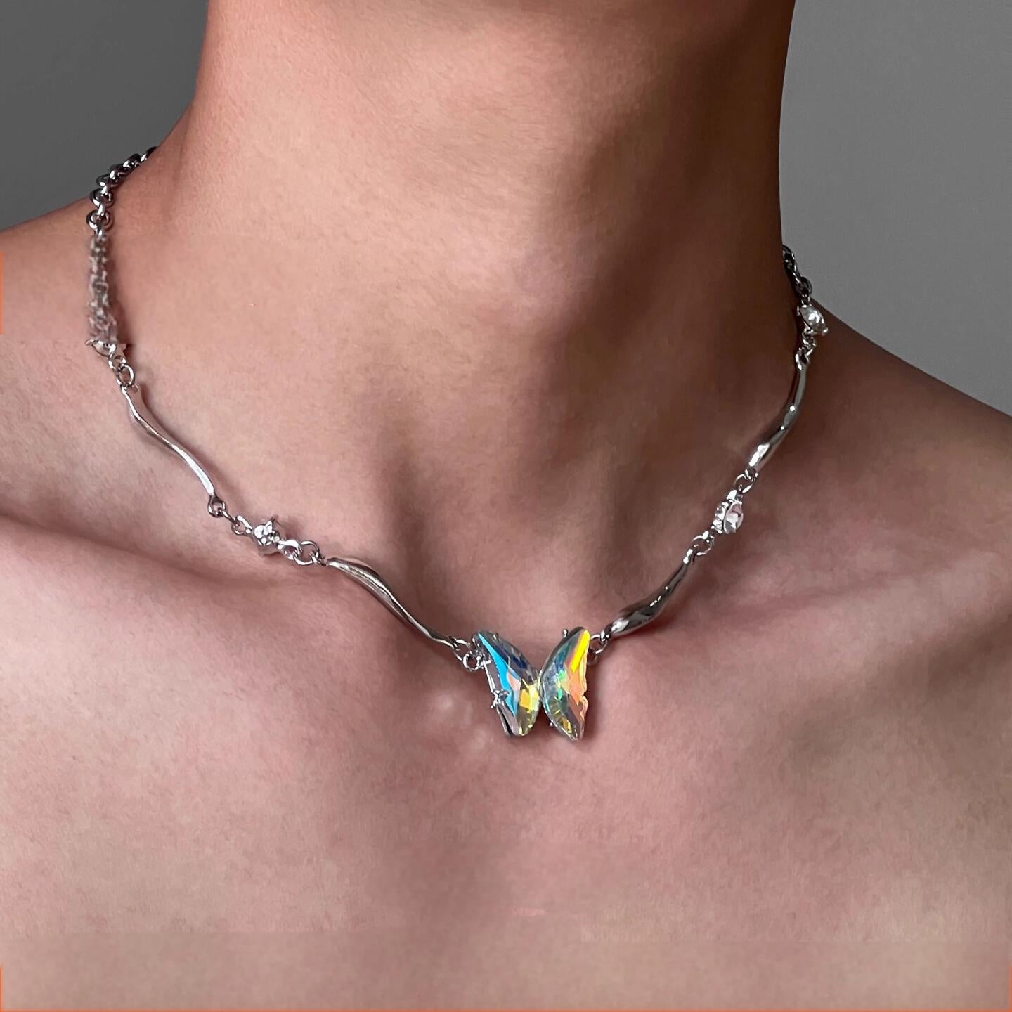 “Male model wearing unisex gradient butterfly silver choker”