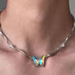 “Cool-sweet aesthetic styling with sculptural butterfly necklace”