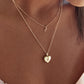 “Elegant woman wearing minimalist heart locket pendant necklace”