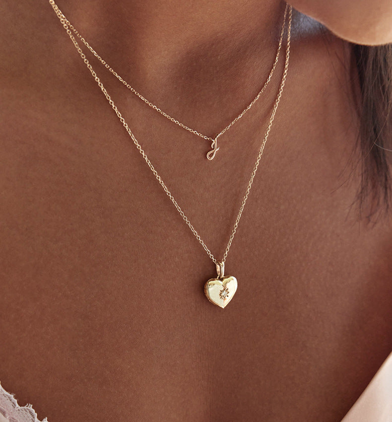 “Elegant woman wearing minimalist heart locket pendant necklace”