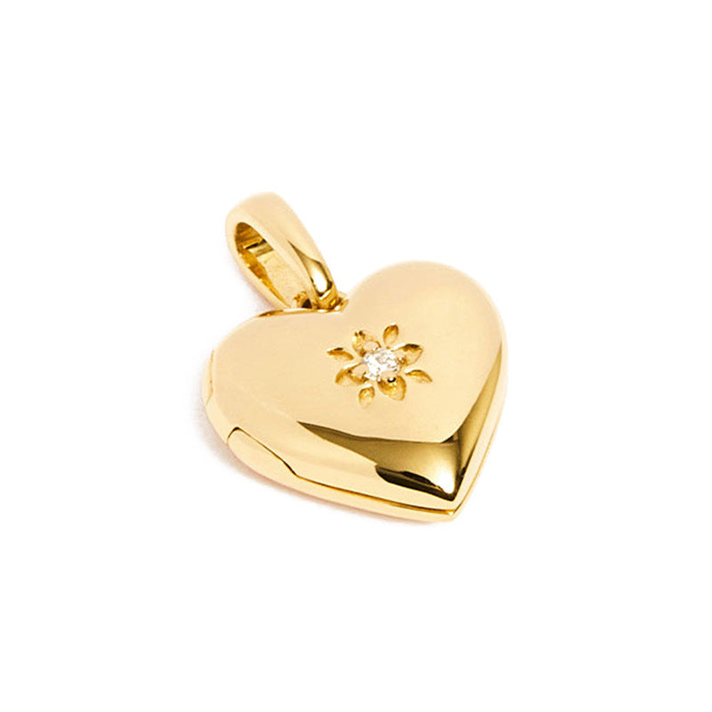 “S925 sterling silver heart locket pendant flat lay on white background”