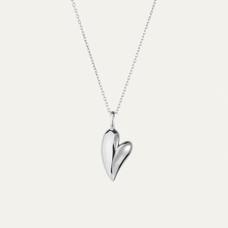 “Minimalist S925 sterling silver heart necklace flat lay on soft background”