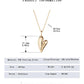 “Elegant minimalist silver jewelry styled with casual outfit”Gold heart-shaped necklace with measurement details on a white background