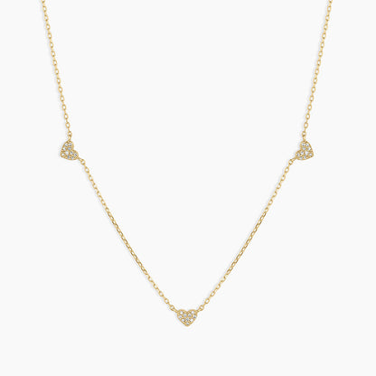 “Flat lay of S925 sterling silver heart pendant necklace with cubic zirconia stone”