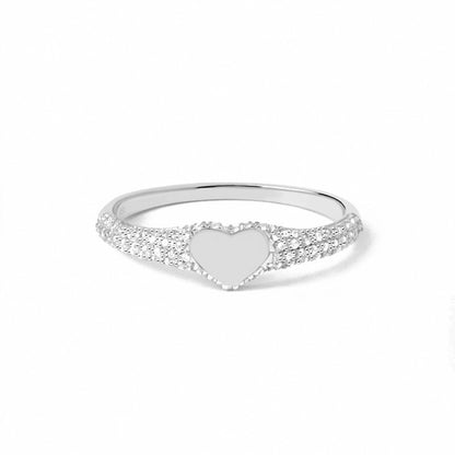 “Flat lay of S925 sterling silver heart signet ring with micro pave cubic zirconia”