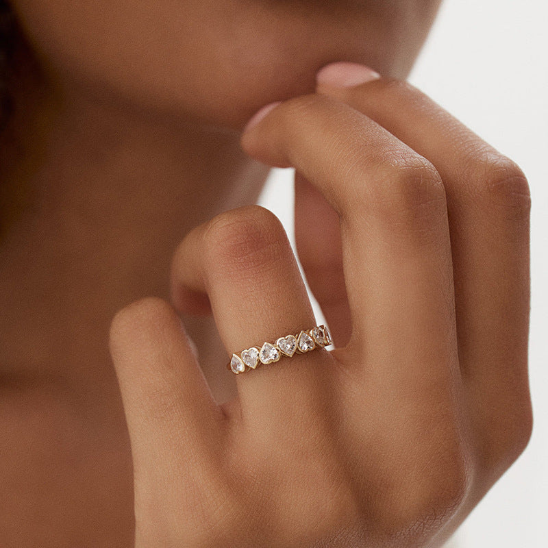 Woman Wearing Minimalist Heart Zircon Silver Ring