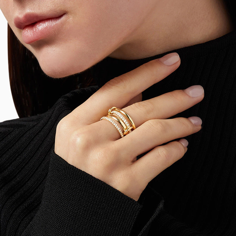 “Woman wearing elegant minimalist four-band pavé ring in sterling silver”