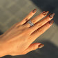 “Woman wearing elegant minimalist four-band pavé ring in sterling silver”