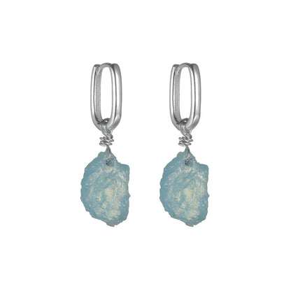 “Irregular aquamarine crystal earrings in S925 silver – flat lay display”