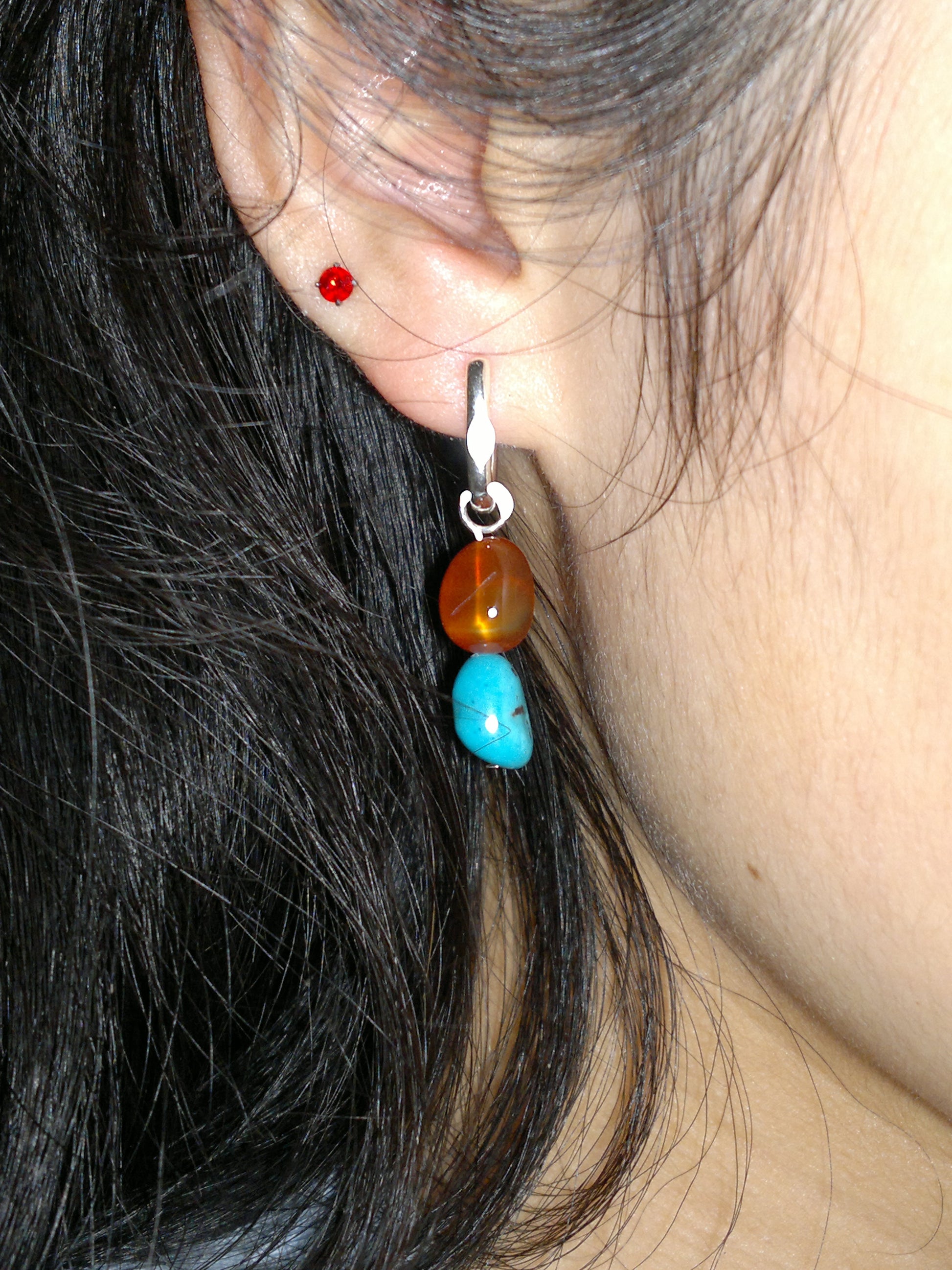 “Unisex red agate and turquoise earrings worn by model – bold ethnic elegance”
