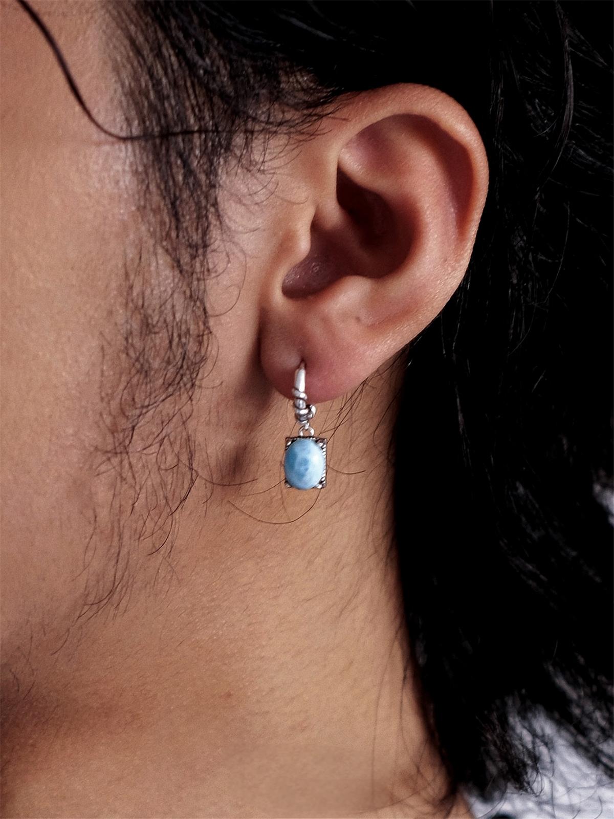 “Vintage-style sterling silver Larimar earrings worn by female model”