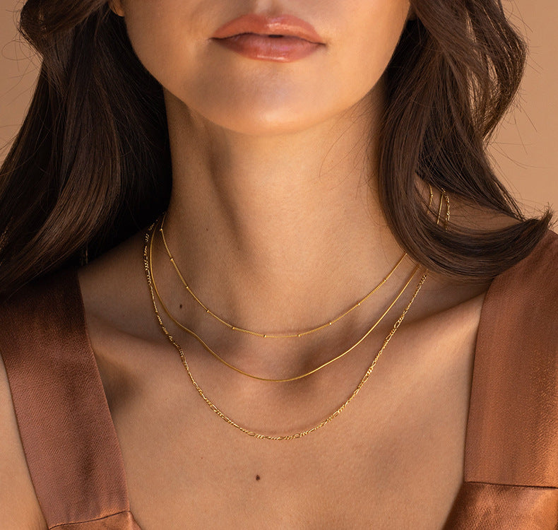 “Woman wearing minimalist S925 sterling silver mixed chain and pearl necklace”