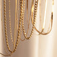 “Close-up of sterling silver box chain and pearl link combination with polished finish”