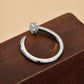 “Flat lay of S925 sterling silver nail design ring with micro-pavé zircon stones”